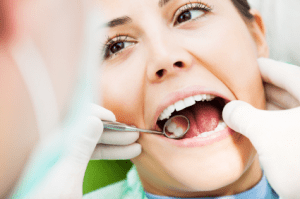 Woman getting her teeth checked at Marbella Dentistry in Cibolo, TX